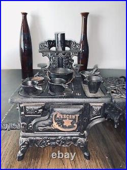 2 Antique Crescent Cast Iron Toy Miniature Childs Cook Stoves With Pots & Pans