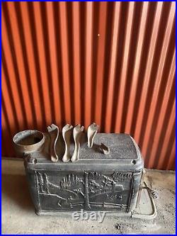 4 Vintage Cast Iron stoves Or heaters In Untested Condition Sold As Is