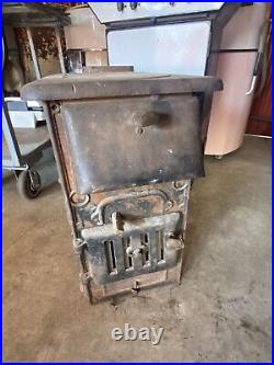 4 Vintage Cast Iron stoves Or heaters In Untested Condition Sold As Is