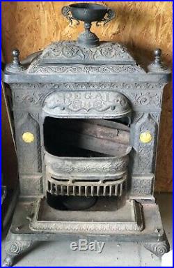 A wonderful antique Victorian ornate cast iron PARLOR STOVE by Regal