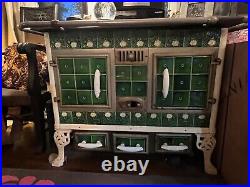 Antique Belgian green Art Nouveau porcelain tile, cast iron stove