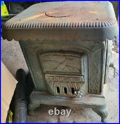 Antique Comfort Wood Burning Stove. Side loading stove RARE