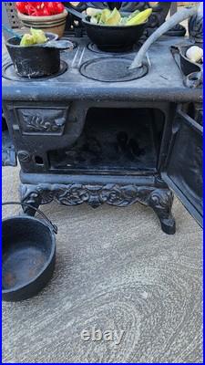 Antique Crescent cast iron large fancy toy stove witha bunch of mini accessories Antique Crescent cast iron large fancy toy stove witha bunch of mini accessories