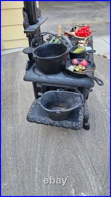 Antique Crescent cast iron large fancy toy stove witha bunch of mini accessories Antique Crescent cast iron large fancy toy stove witha bunch of mini accessories