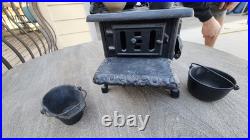 Antique Crescent cast iron large fancy toy stove witha bunch of mini accessories Antique Crescent cast iron large fancy toy stove witha bunch of mini accessories