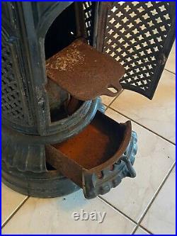 Antique French cast-iron stove, cast-iron enameled tall round stove, circa 1910