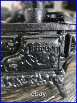 Antique Resident cast iron stove vendor model