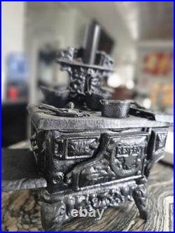 Antique Resident cast iron stove vendor model