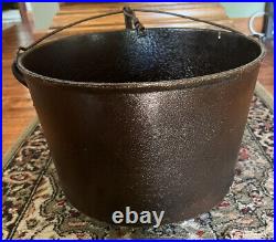 Antique cast iron 3 legged pot with stove hanger