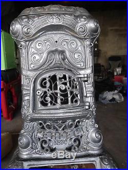 Antique cast iron parlor stove extremely ornate