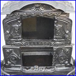 Antique cast iron parlor wood stove by Thomas, Roberts, Stevenson & Co