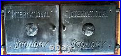 Antique cast iron stove furnace boiler doors matching pair c. 1925 19w x 18h