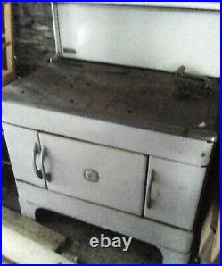 Antique kitchen stove. Coal or wood. Cast iron cook top