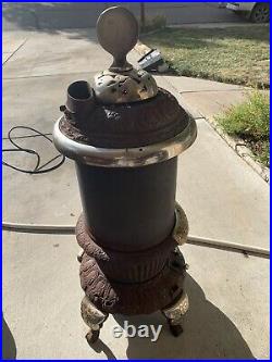 Antique round oak potbelly stove