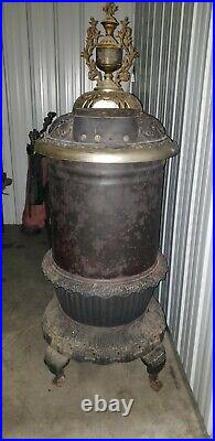 Antique round oak potbelly wood stove