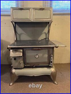 Antique wood burning cook stove with warmer