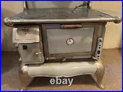 Antique wood burning cook stove with warmer