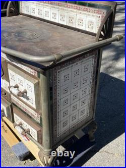 European cast iron stove with decorative tiles European cast iron stove with decorative tiles