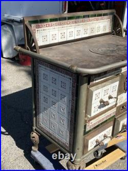 European cast iron stove with decorative tiles European cast iron stove with decorative tiles