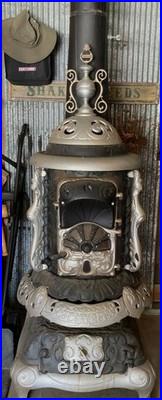 Florence 153 Antique Cast Iron Parlor Stove. Fair Condition