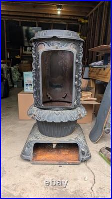 Florence 153 Antique Cast Iron Parlor Stove. Fair Condition