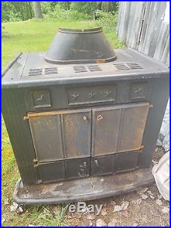 Franklin wood burning stove/fireplace. All cast iron from the 70s. Piping included