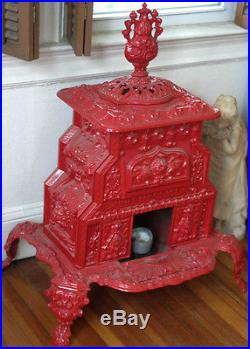 Late 1800's Victorian Era red cast iron parlor stove, made in Troy New York