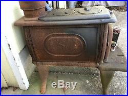 R- Household Cast Iron Wood Burning Stove Is Black Holds 22 Logs 7 Pipe Hole