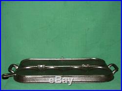 Similar to Wagner No. 4 (#8) Cast Iron Stove Top Pancake 4 Section Flip Griddle