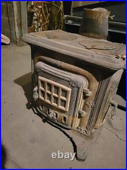 Stout Cast Iron Wood Burning Stove, double burner Chip in the base free standing
