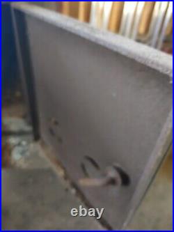 Used freestanding wood stove. For heating with exhaust pipe