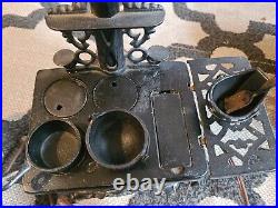 Vintage Crescent cast iron salesman sample stove with accessories lamp