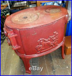 Vintage L. Lange Cast Iron Wood Stove Red with stove pipe