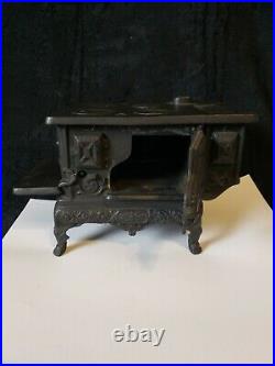 Vintage Oak Cast Iron Salesman Display Stove with pots and pans
