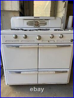 Vintage roper gas stove with 4 cast iron burners oven and warming drawer