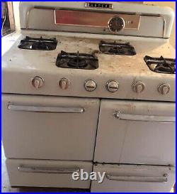 Vintage roper gas stove with 4 cast iron burners oven and warming drawer